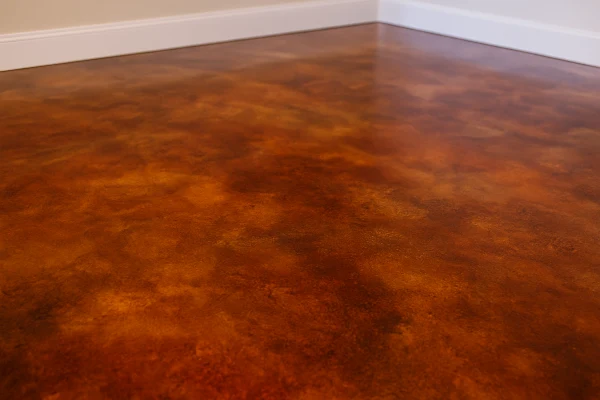 a red epoxy floor from Concrete Contractor Hutto in Hutto, TX - Concrete Parking Lot Building